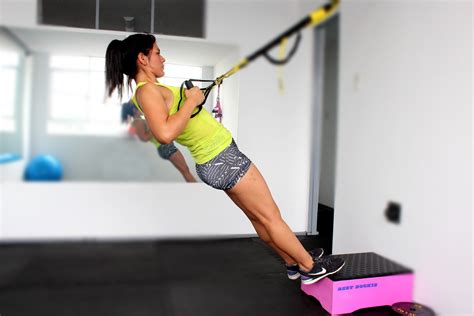 TRX exercises: triceps extension, one-leg squat, and plank-to-pike ...