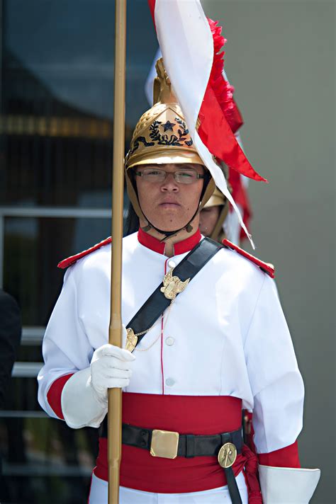 A Brazilian soldier stands at attention wearing a traditional uniform during a welcome ceremony ...