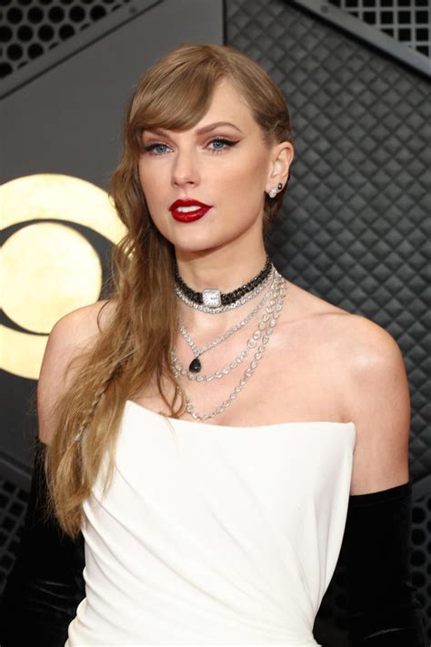 Taylor Swift wore white dress with black accessories on Grammys red carpet