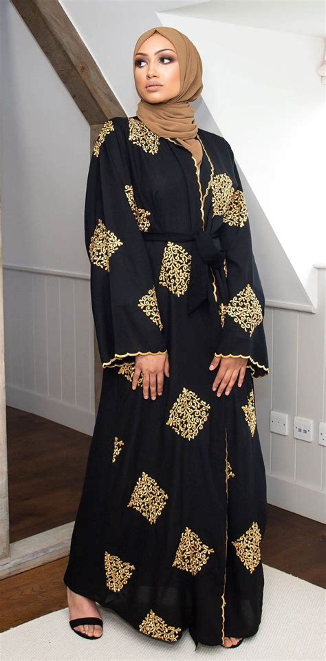 A stunningly beautiful abaya of gold emboidery on rich black linen ...