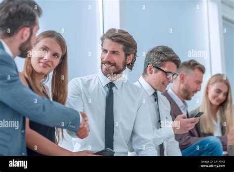 business people greet each other with a handshake Stock Photo - Alamy