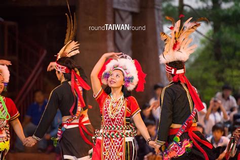 some people are doing something in the air with their headdresses and feathers