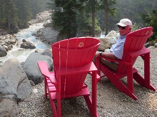 Glacier Red Chairs | David Stanley relaxing on a red chair i… | Flickr