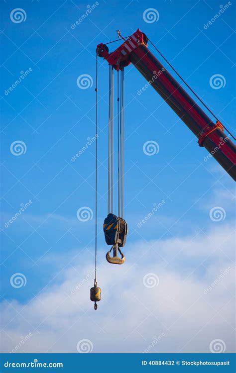 Crane hook on a blue sky stock photo. Image of lift, metallic - 40884432