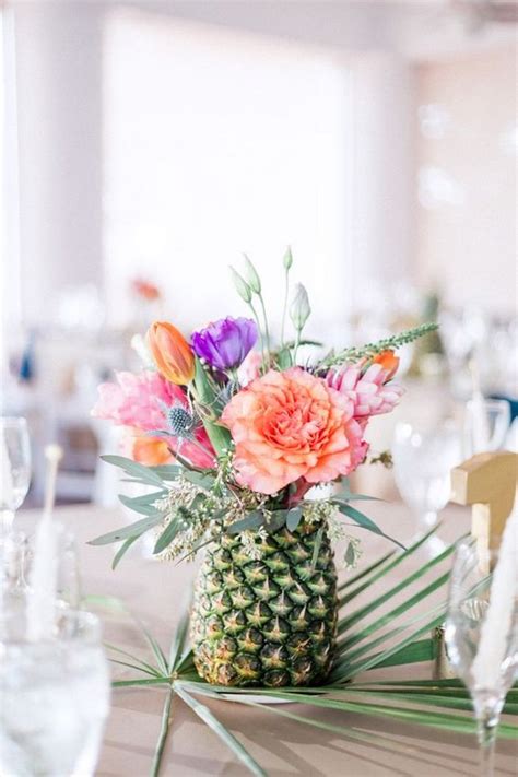 pineapple floral centerpiece for a tropical wedding - EmmaLovesWeddings