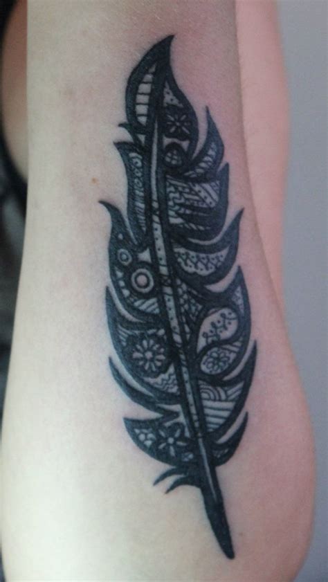 Detailed black feather tattoo. | Feather tattoo, Tattoos, Tribal tattoos