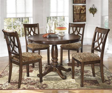 Signature Design by Ashley Leahlyn 5-Piece Cherry Finish Round Dining Table Set | Del Sol ...