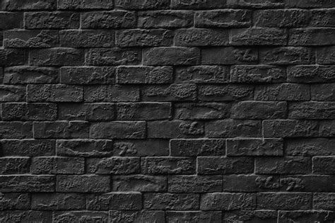 Premium Photo | Black stone brick wall texture