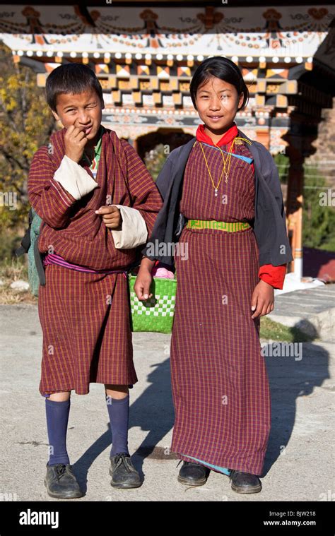 Boy and Girl wearing Gho and Kira national dress Bhutan Stock Photo - Alamy