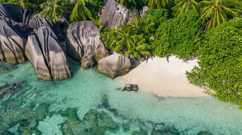 Drone view of Anse Source D'Argent beach in summer, La Digue Island ...