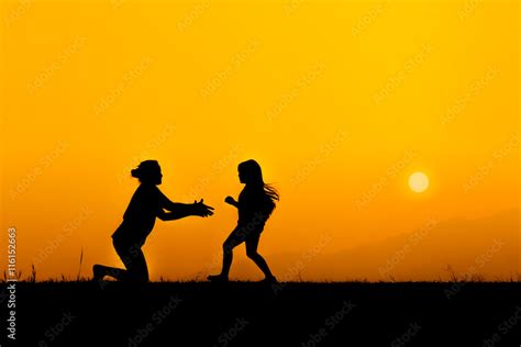 Silhouette of a family in sunset Stock Photo | Adobe Stock