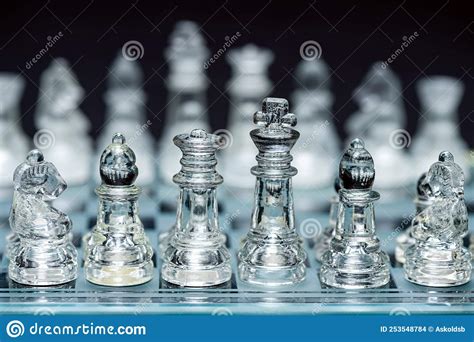 Glass, Transparent Chess Pieces on a Checkerboard, Selective Focus, Close-up, Isolated on Black ...