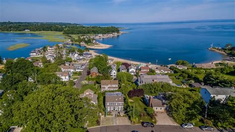 an aerial view of a neighborhood by the water