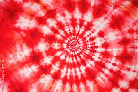 Red tie-dye texture with a mesmerizing spiral pattern, created with Generative Ai Technology ...