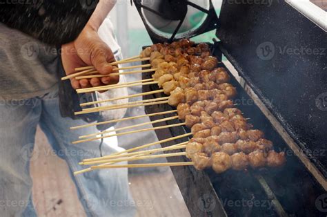 Grilled meatballs in skewers, bakso pentol bakar with soy sauce ...