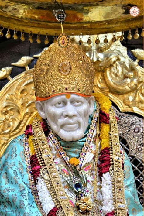 an image of a statue that looks like he is wearing a gold crown and has many necklaces around ...