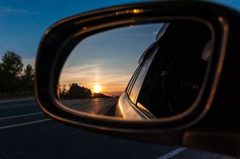 Premium Photo | Sunset in the rear view mirror of a car