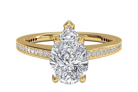 a yellow gold engagement ring with a pear shaped diamond on the band and side stones