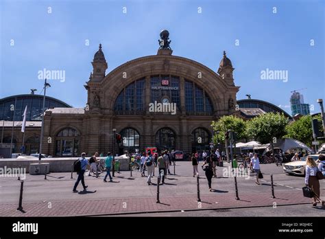 Frankfurt, Germany - July 2019: Frankfurt Main Train station architecture and people around. The ...