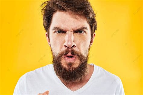 Closeup Of Emotional Bearded Man Expressing Aggression And Discontent Through Hand Gestures On A ...