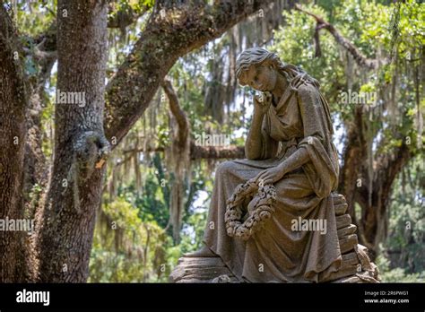 Historic Bonaventure Cemetery memorial amidst Southern live oaks and Spanish moss in Savannah ...