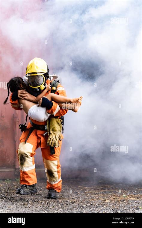 Firefighter rescue victim hi-res stock photography and images - Alamy