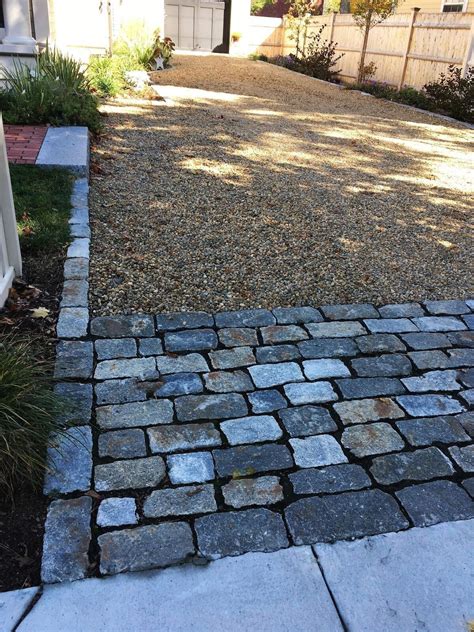 Driveway with cobblestone edging & border and a granite entrance ...