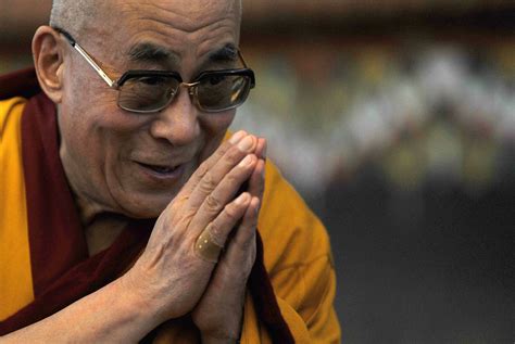 Tibetan Spiritual Leader the Dalai Lama gestures during a ritual and ...