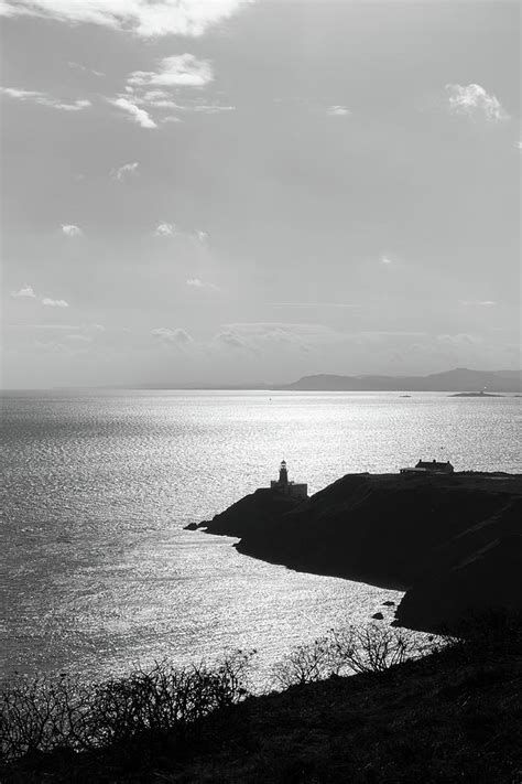 View of Howth Head with the Baily Lighthouse in black and white ...