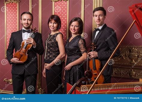 Classical Music Quartet Posing after the Concert. Stock Photo - Image of four, instruments: 73773772