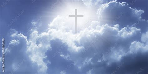 Christian cross appeared bright in the sky with soft fluffy clouds, white, beautiful colors ...