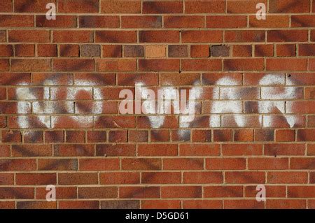 No War sign graffiti on brick wall in protest against military army ...