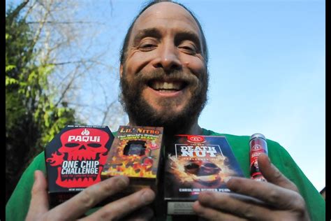 Coquitlam man eats world's spiciest gummy bear to raise $5,000 for food bank - North Shore News