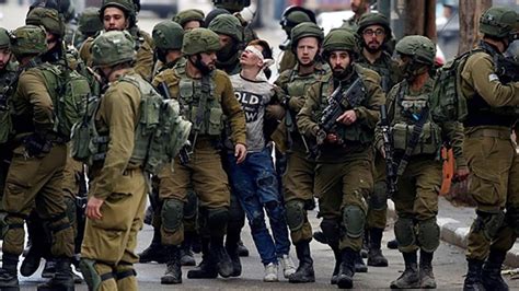 'Beaten' Palestinian boy in viral photo charged | Palestine News | Al ...