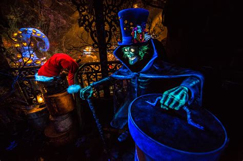 First Look: Hatbox Ghost Joins the Celebration in Haunted Mansion ...