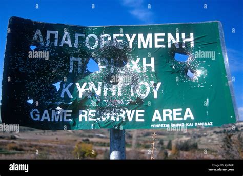 Game reserve sign blasted full of holes. Shooting in Cyprus nature ...