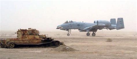 @MilitaryPorn: An A10 taxiing past a destroyed Iraqi tank. | Iraqi tank ...