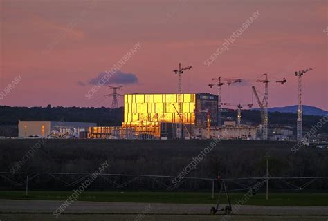 ITER fusion research reactor building at sunrise - Stock Image - C053/0080 - Science Photo Library