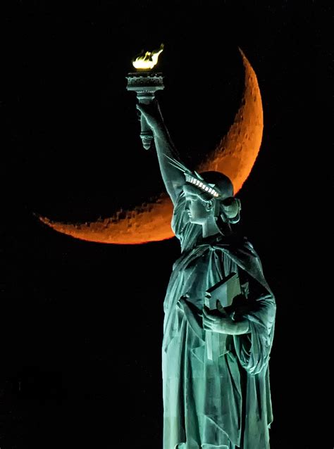 Moon Behind Statue of Liberty | Smithsonian Photo Contest | Smithsonian Magazine