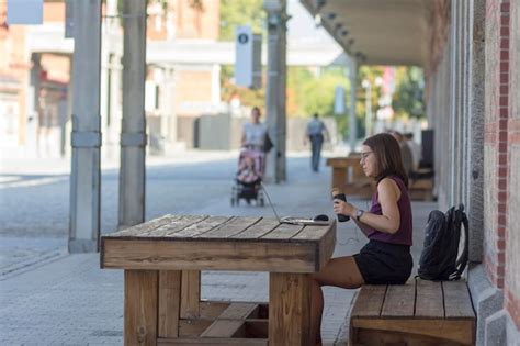 Premium Photo | Woman working on laptop outdoors