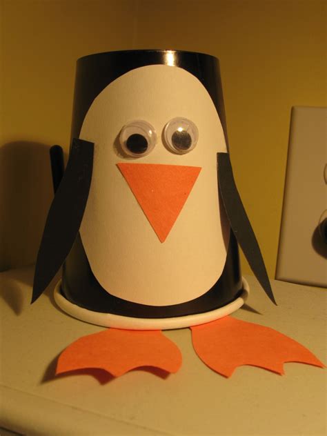 Penguin craft-cut out the pieces and use black cups. Two googly eyes ...