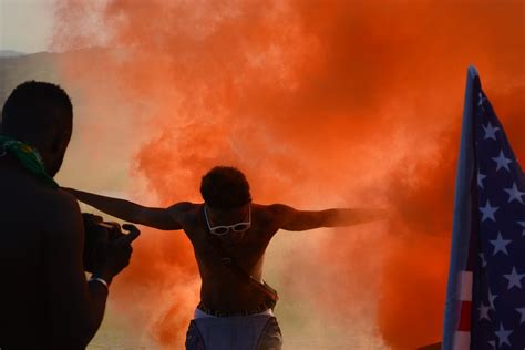 Photo of Man Surrounded With Orange Smoke · Free Stock Photo