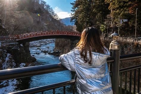 Tourist Woman Looking at Shinkyo Bridge, Nikko, Japan in Winter Stock Image - Image of tochigi ...