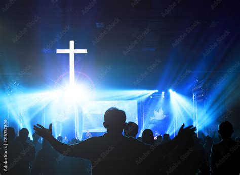 Church worship concept:Christians raising their hands in praise and ...