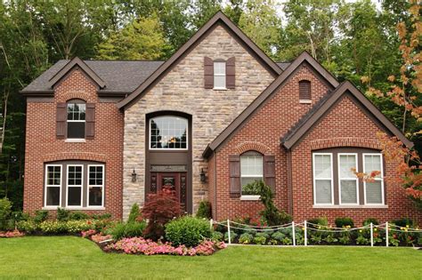 Suburban home with brick and stone combination facade.