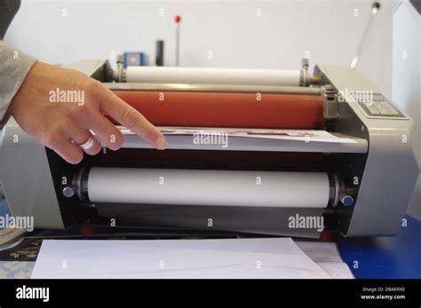 Plastic laminating machine Stock Photo - Alamy