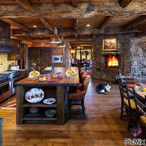 a large kitchen with wooden floors and stone walls, along with a dining room table set for four