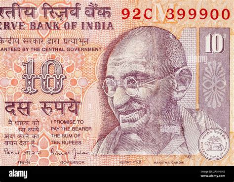 Mahatma Gandhi face on Indian bank note ten rupees. 10 Rupee National currency of India INR ...