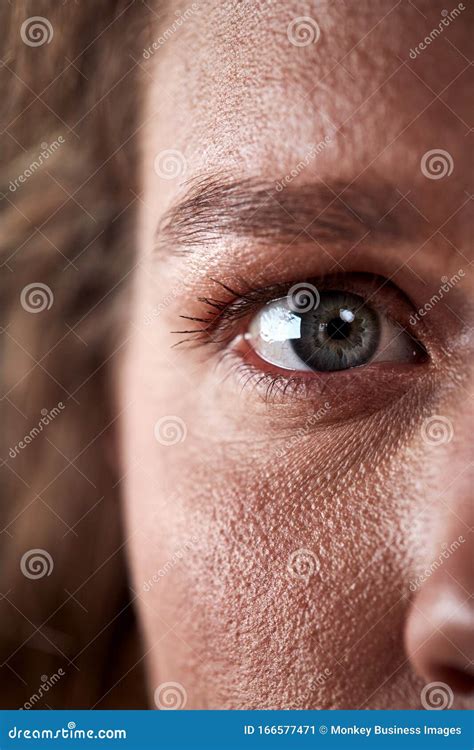 Close Up of Eye of Woman Looking Scared Against Black Studio Background Stock Image - Image of ...