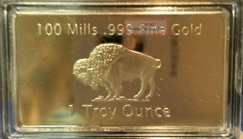 1 Troy Ounce Gold Buffalo Bar 100 Mills Clad. 999 24k Fine Bullion Bar.